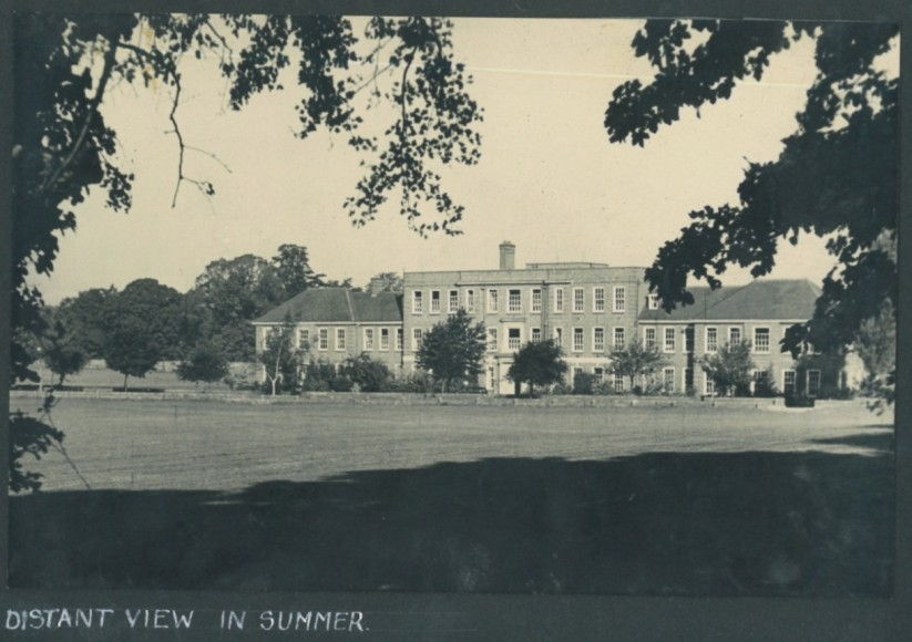 An early photograph of the school in summer.